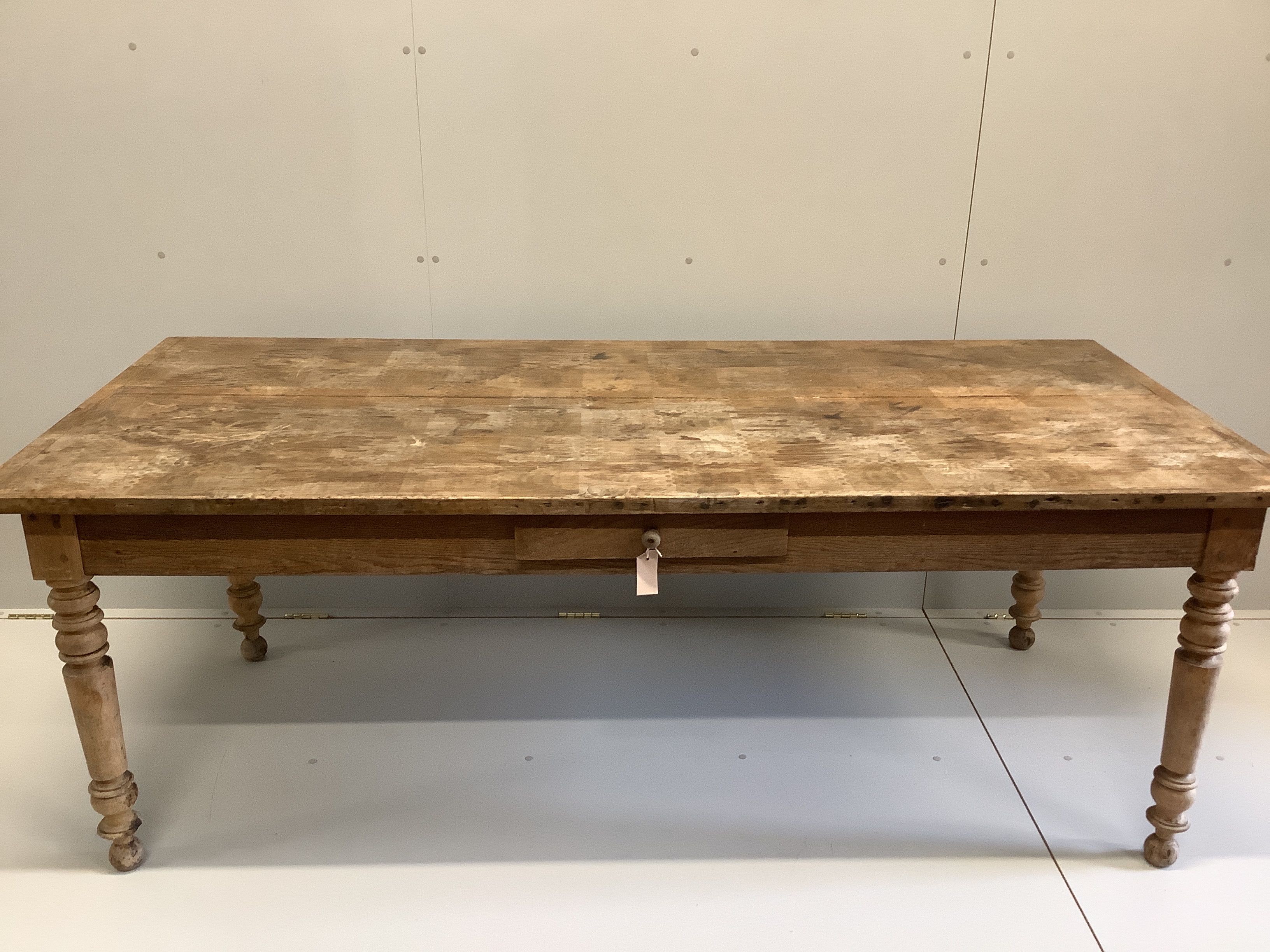 A 19th century French rectangular oak and fruitwood kitchen table, fitted drawer, width 202cm, depth 90cm, height 74cm